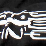 white buggy rollin log printed on black back ground on the right sleeve