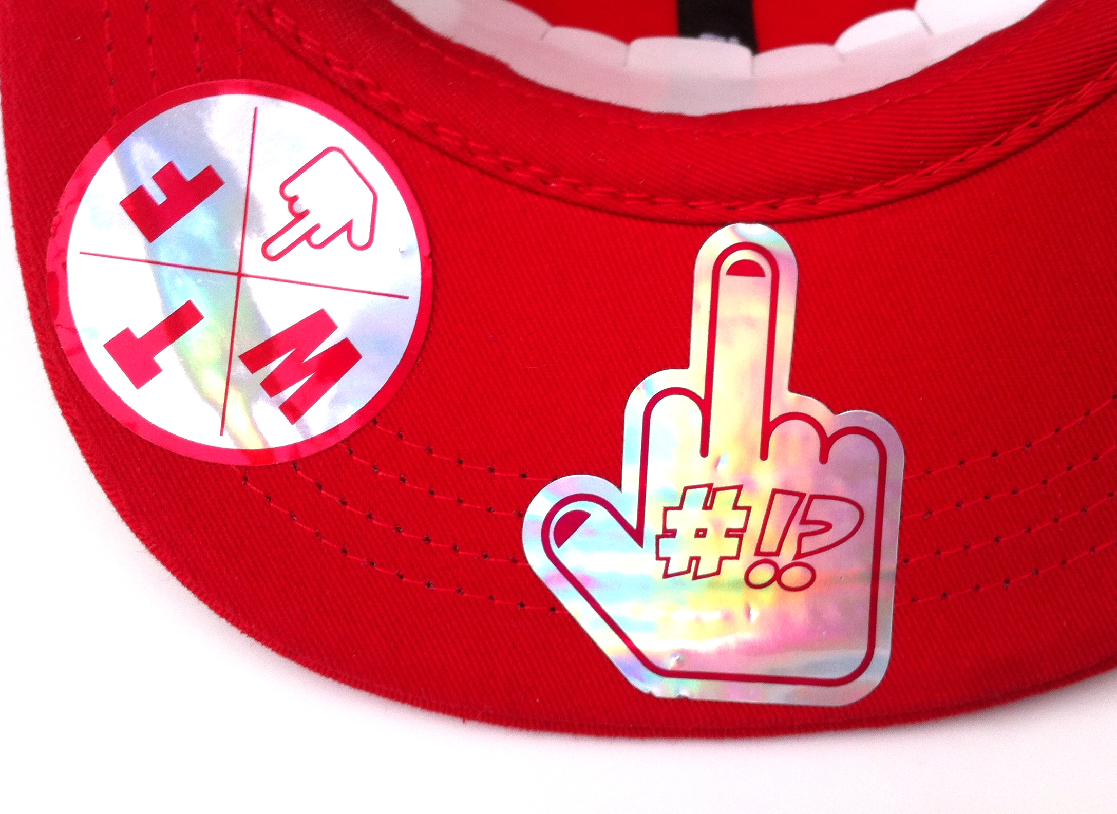 finger under the red WTF rollerman cap