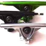 3 randall trucks of different colors. metal, green and black