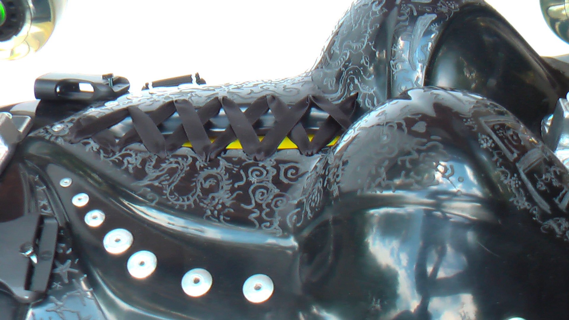 detail of the design cloud and dragon on the boob of buggy rollin woman chest