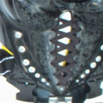 détail of the laces of the woman engraved buggy rollin wheel chest